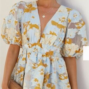 Elegant Floral Semi-Sheer Midi Dress with Puff Sleeves Size 12 pre-owned.